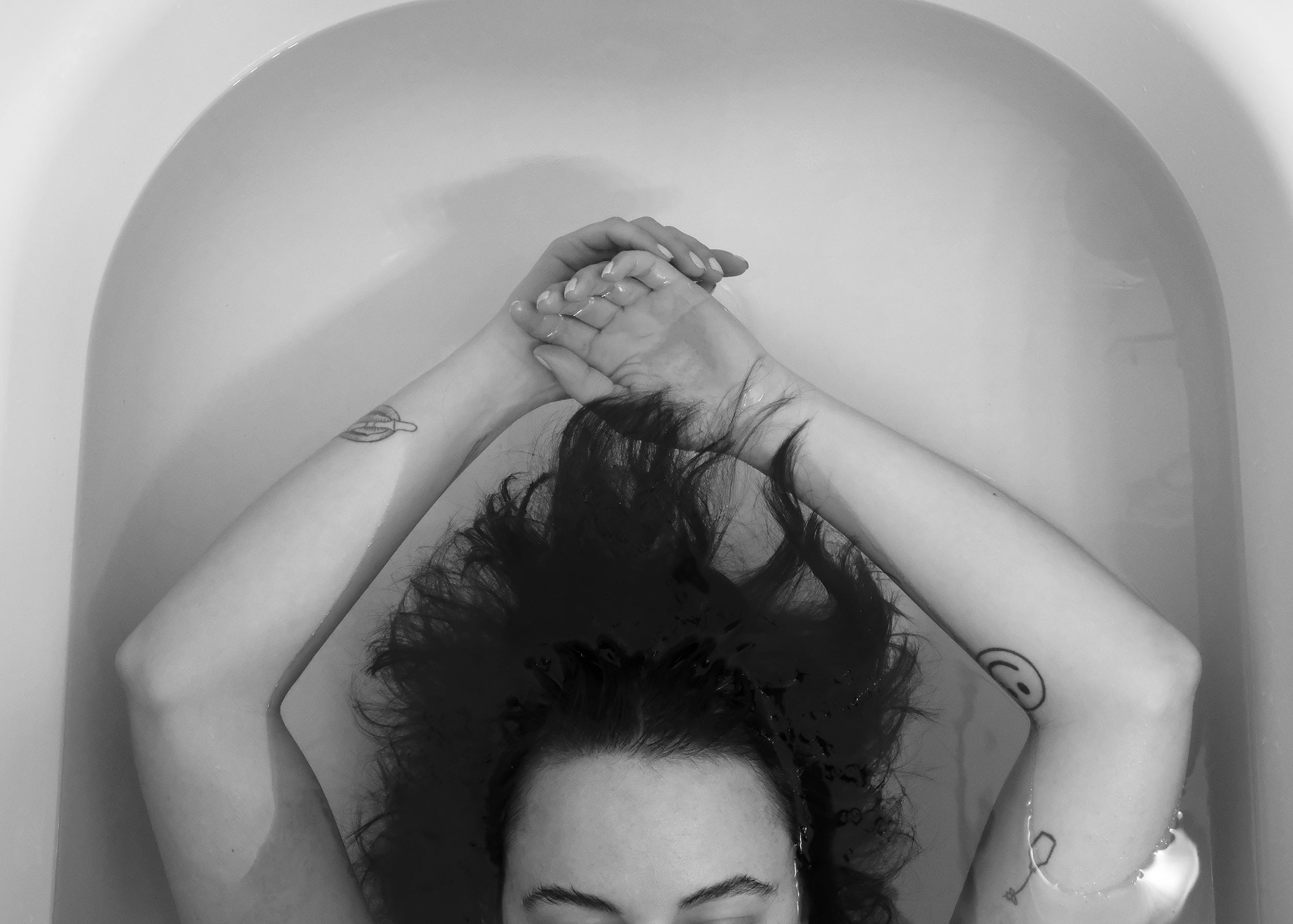 white female in bath with hair